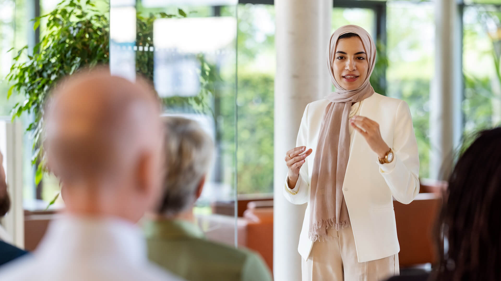 woman-stands-and-speaks-unconscious-bias-training